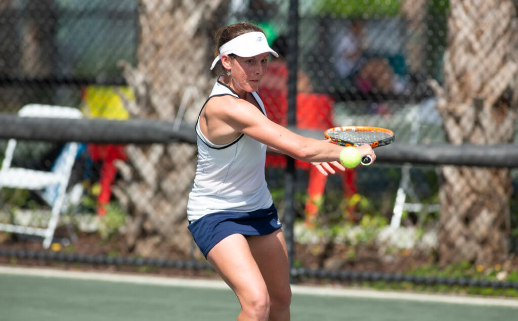 Elly Shearman playing tennis.