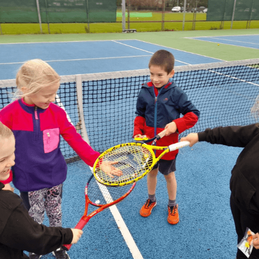 Advanced Sunday Tennis Lessons for Children playing in matches.